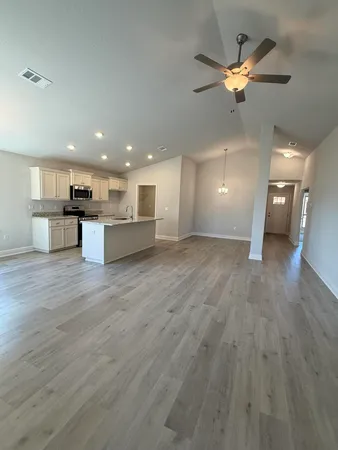 an empty room with a empty space and windows