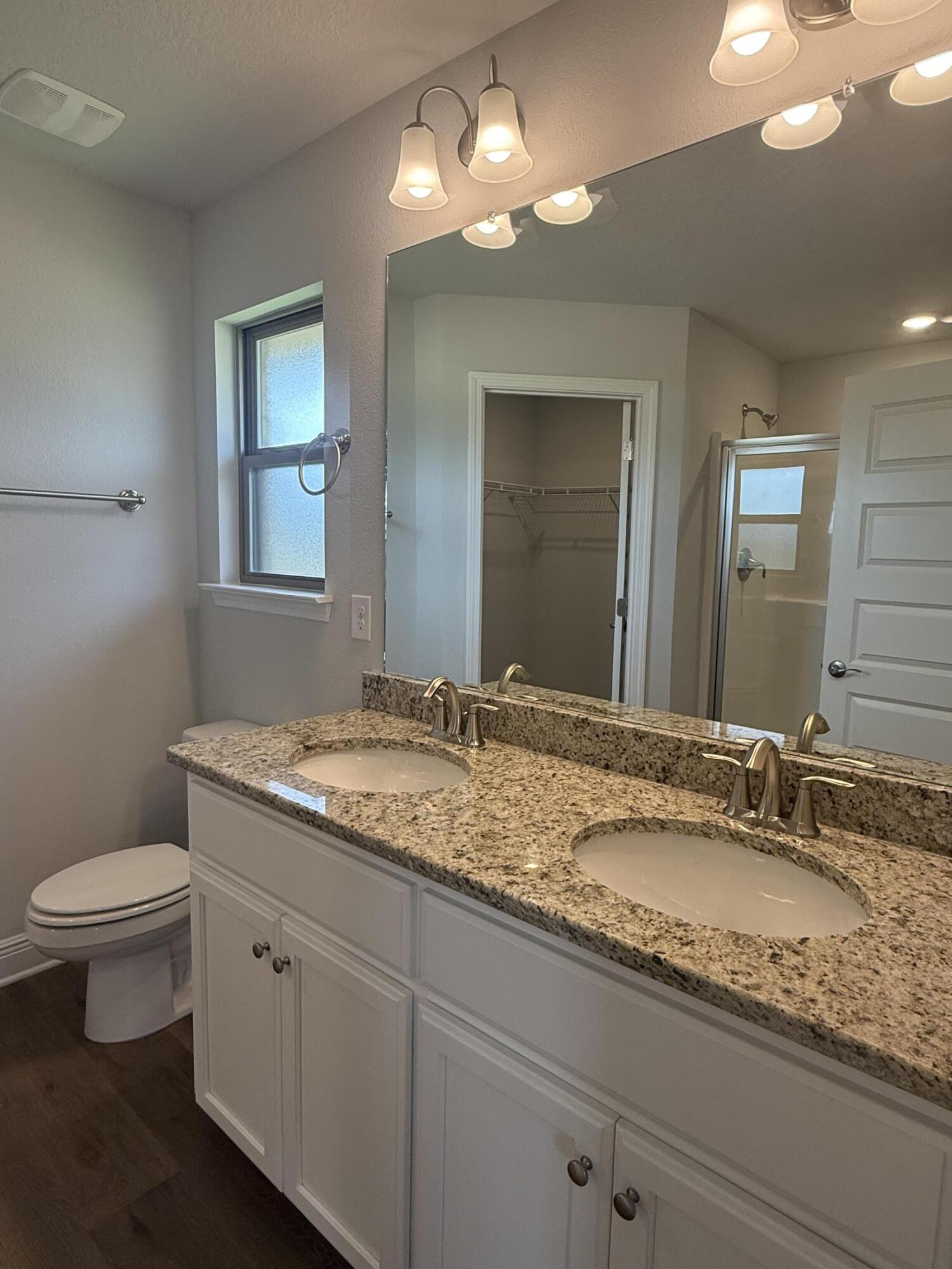 190 Ridgeway Circle Crestview, FL 32536 - Photo 17 of 19 a bathroom with a granite countertop sink and a toilet
