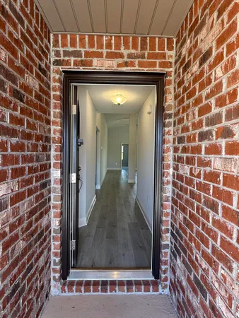 a view of kitchen with cabinets and wooden floor