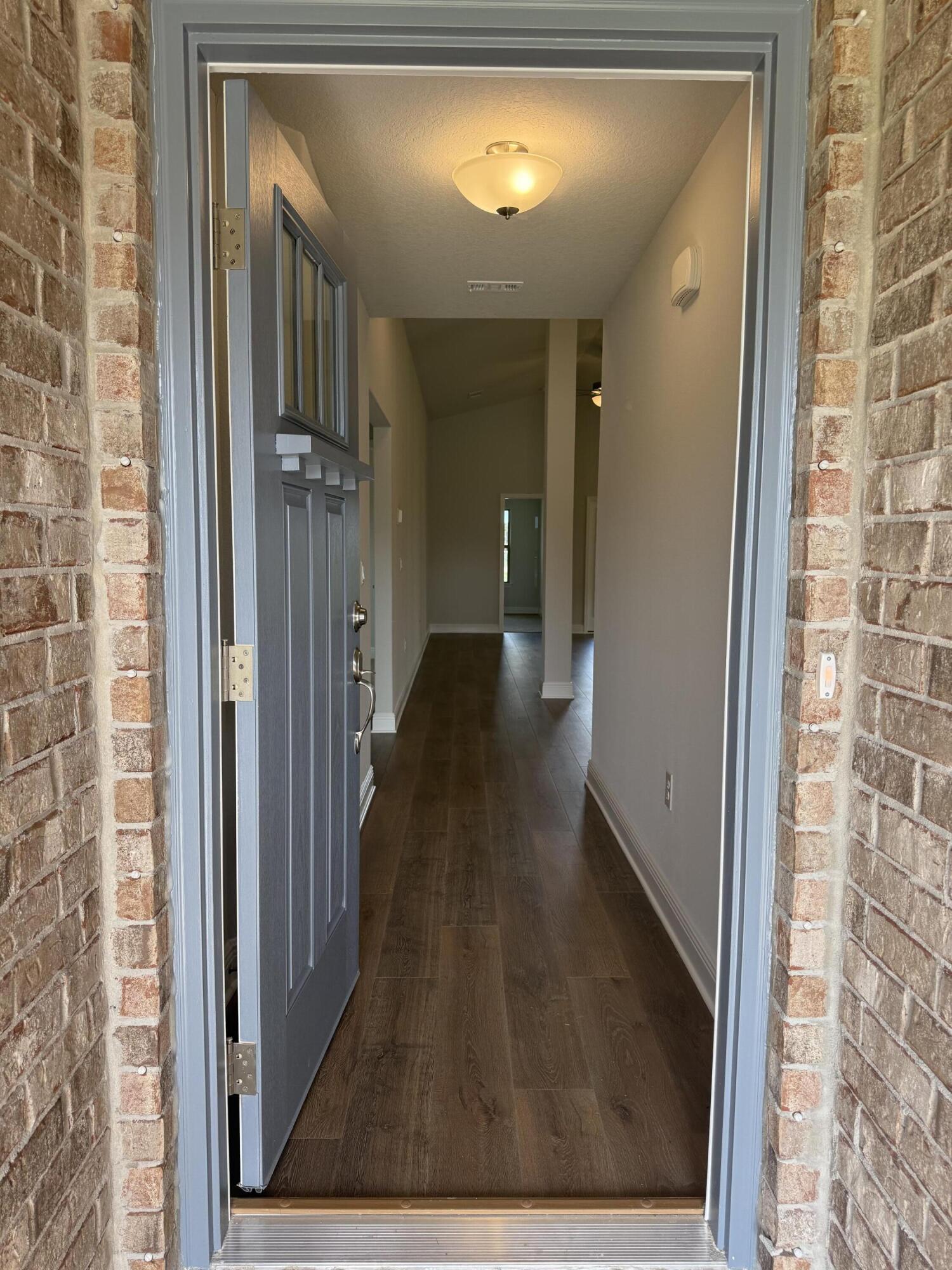 190 Ridgeway Circle Crestview, FL 32536 - Photo 5 of 19 a view of a hallway with wooden floor and staircase