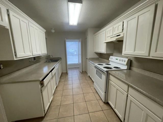 804 Cullum Court, Unit A Hurst, TX 76053 - Photo 12 of 29 a kitchen with stainless steel appliances a sink stove and cabinets