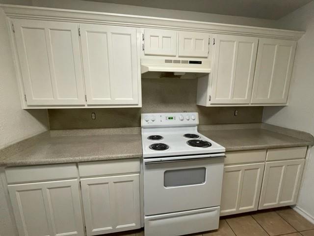 804 Cullum Court, Unit A Hurst, TX 76053 - Photo 13 of 29 a kitchen with white cabinets and white appliances