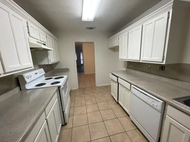 804 Cullum Court, Unit A Hurst, TX 76053 - Photo 14 of 29 a kitchen with stainless steel appliances granite countertop a sink stove and cabinets