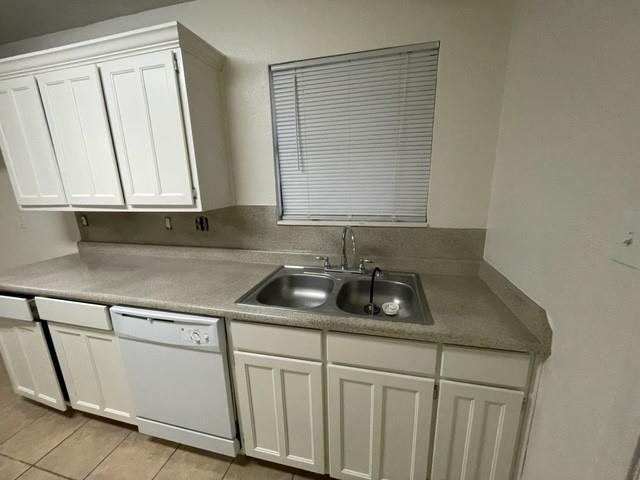 804 Cullum Court, Unit A Hurst, TX 76053 - Photo 15 of 29 a kitchen with white cabinets and a sink