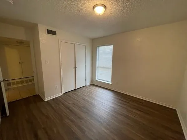 a view of a livingroom with wooden floor