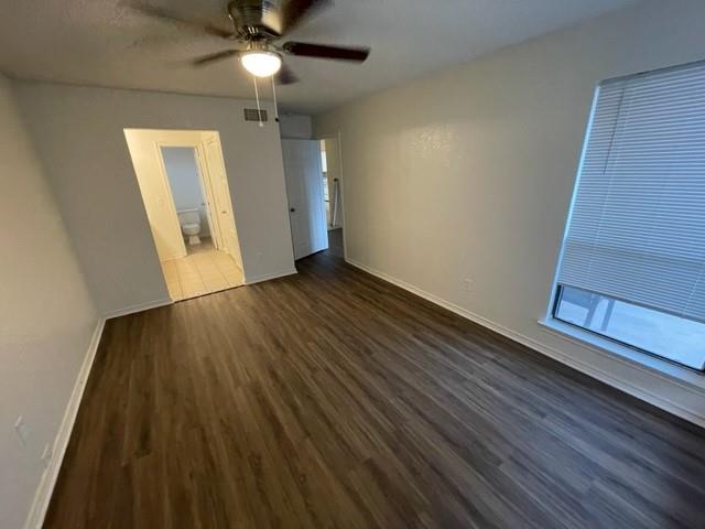 804 Cullum Court, Unit A Hurst, TX 76053 - Photo 19 of 29 wooden floor in an empty room with a window