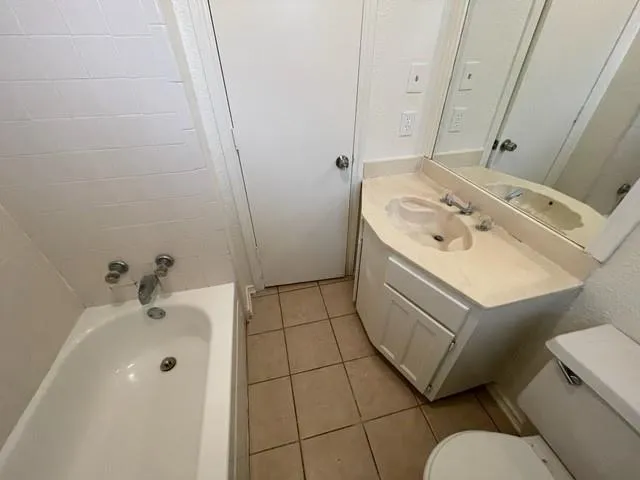 a bathroom with a sink toilet and tub