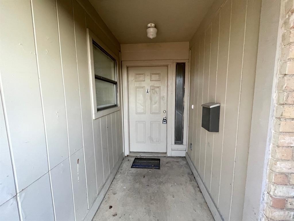 804 Cullum Court, Unit A Hurst, TX 76053 - Photo 2 of 29 a view of a hallway with wooden floor and closet