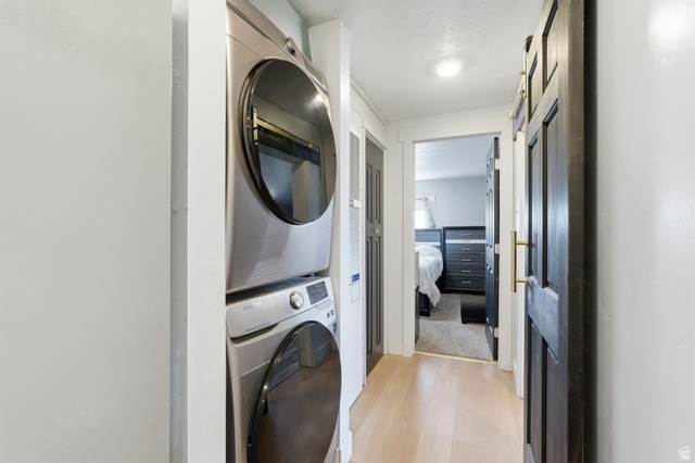 2500 North Fort Lane, Unit 220 Layton, UT 84041 - Photo 9 of 23 Dedicated laundry area featuring a stacked washer and dryer