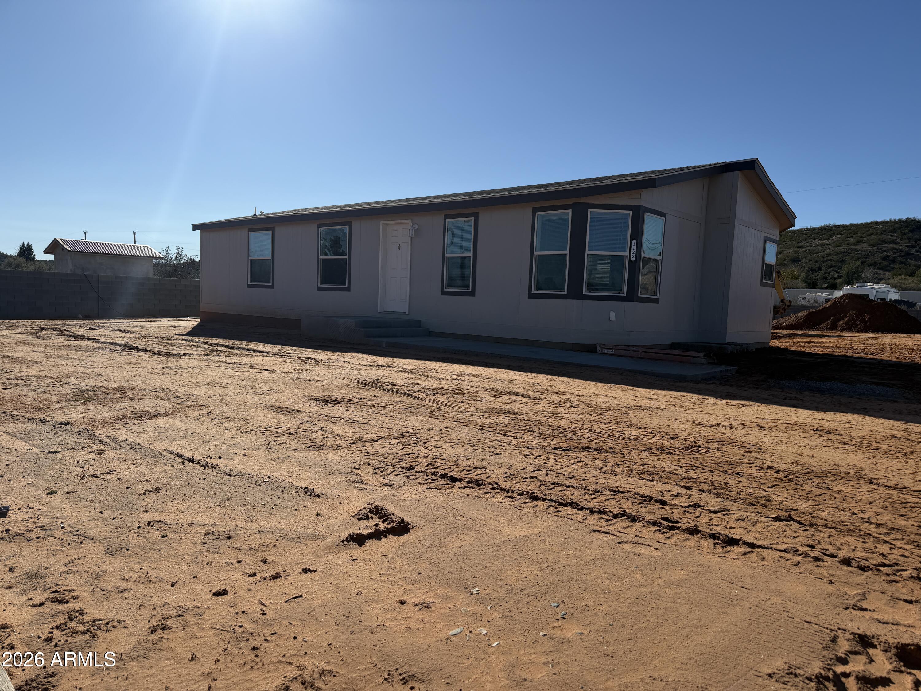 a house view with a garden space