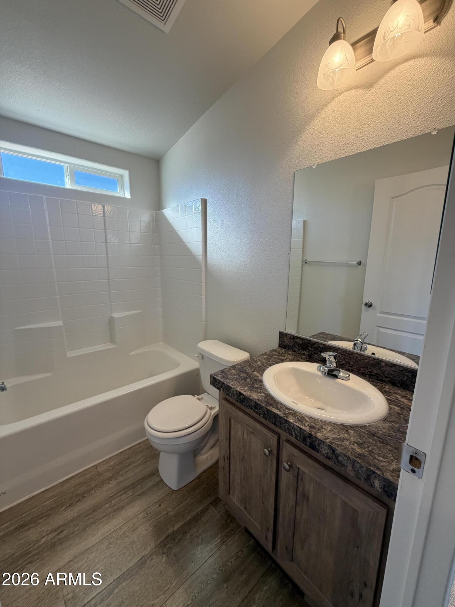 1122 Sheepshead Crossing Road Cornville, AZ 86325 - Photo 11 of 13 a bathroom with a sink a toilet a mirror and shower