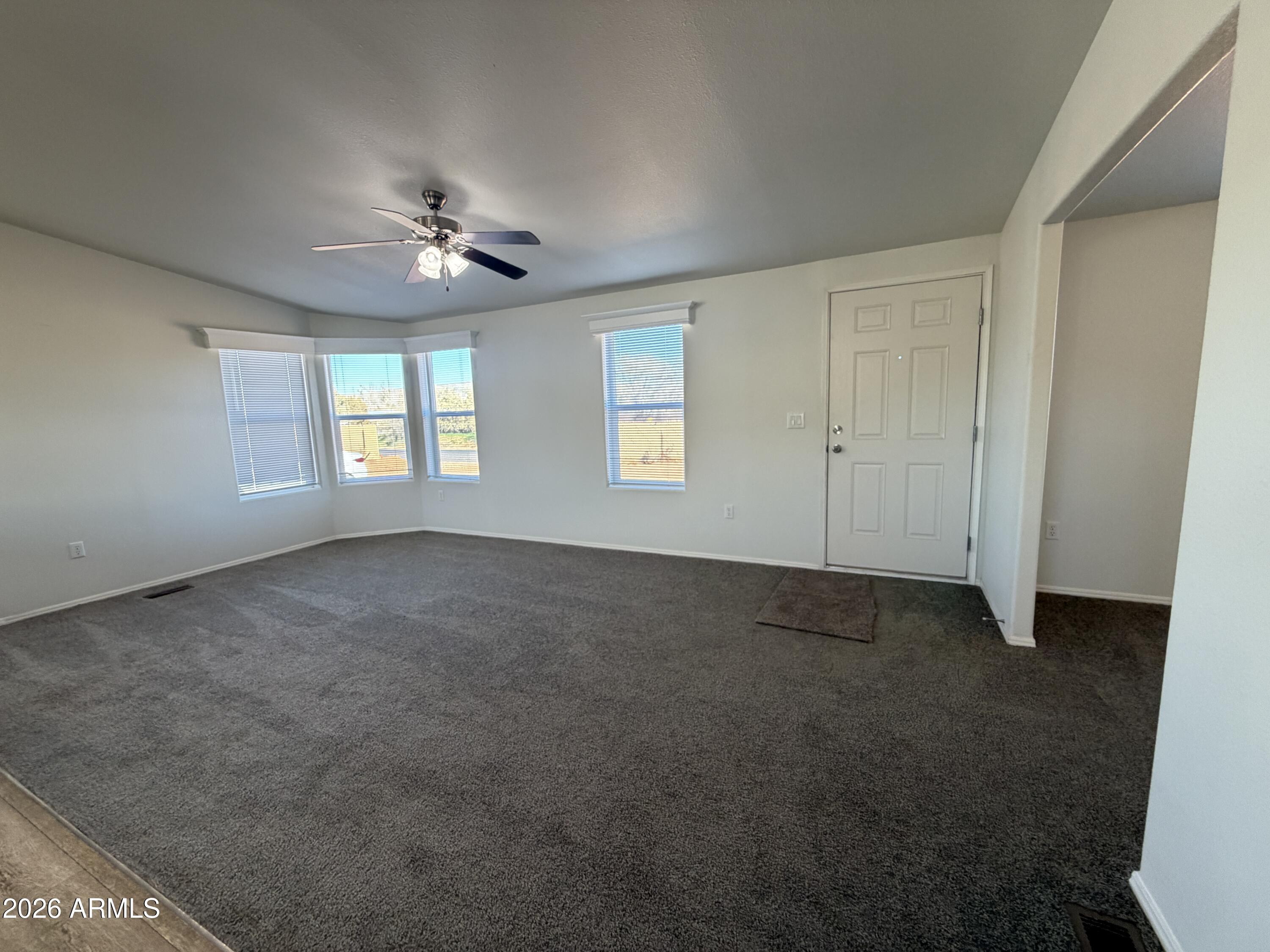 1122 Sheepshead Crossing Road Cornville, AZ 86325 - Photo 2 of 13 a view of empty room with windows