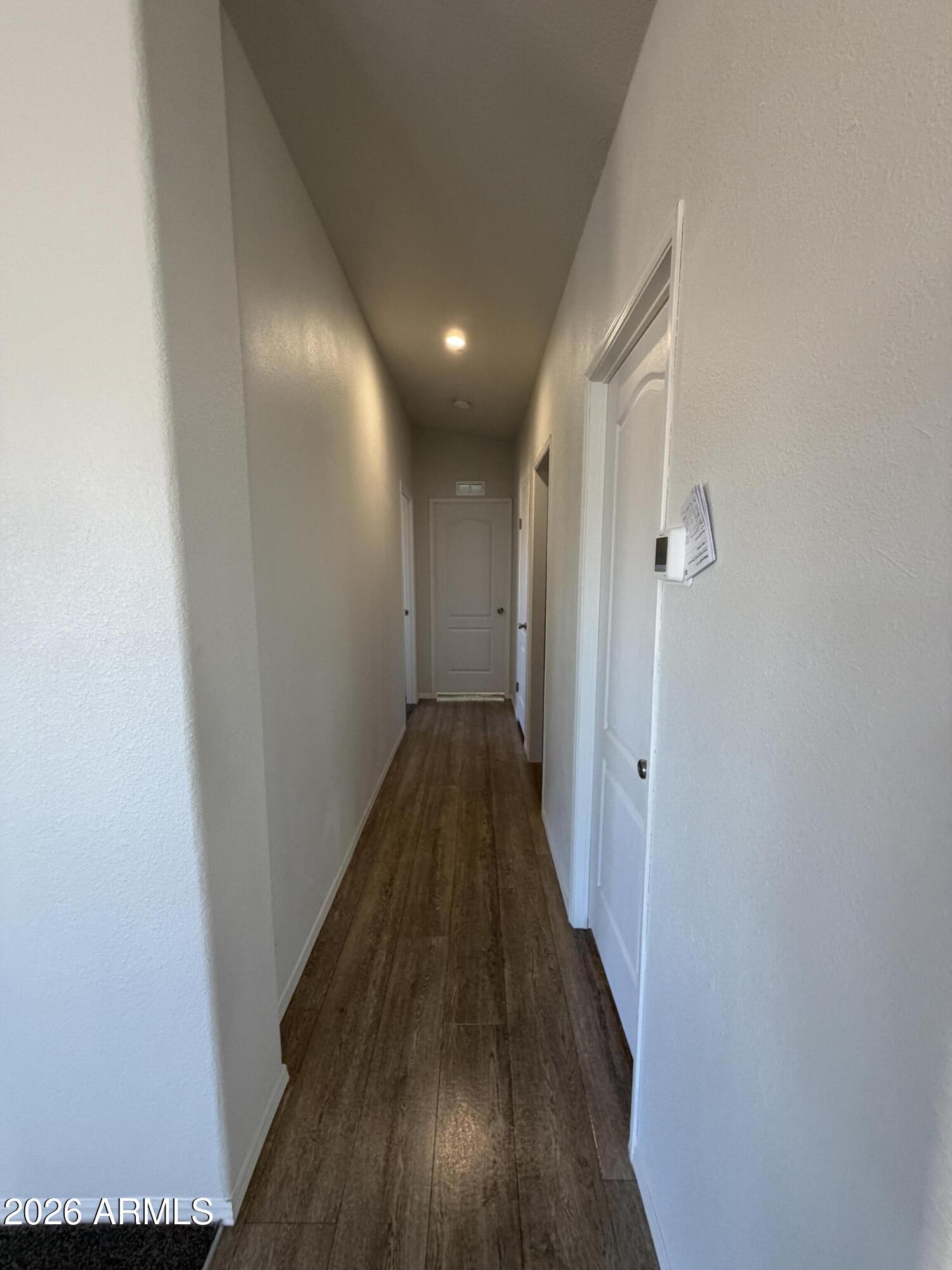 1122 Sheepshead Crossing Road Cornville, AZ 86325 - Photo 9 of 13 a view of a hallway with wooden floor