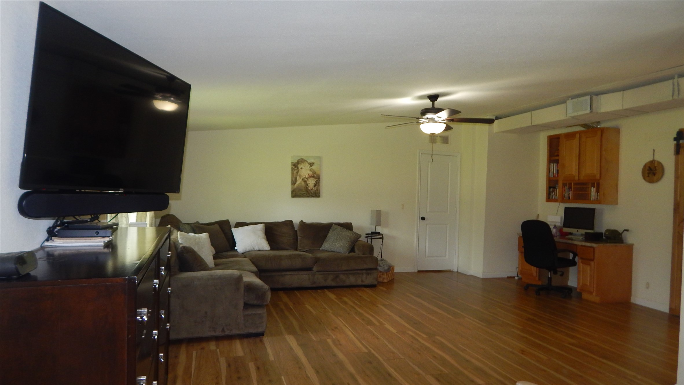 142 County Road 1332 Liberty, TX 77575 - Photo 12 of 50 a living room with furniture and a flat screen tv
