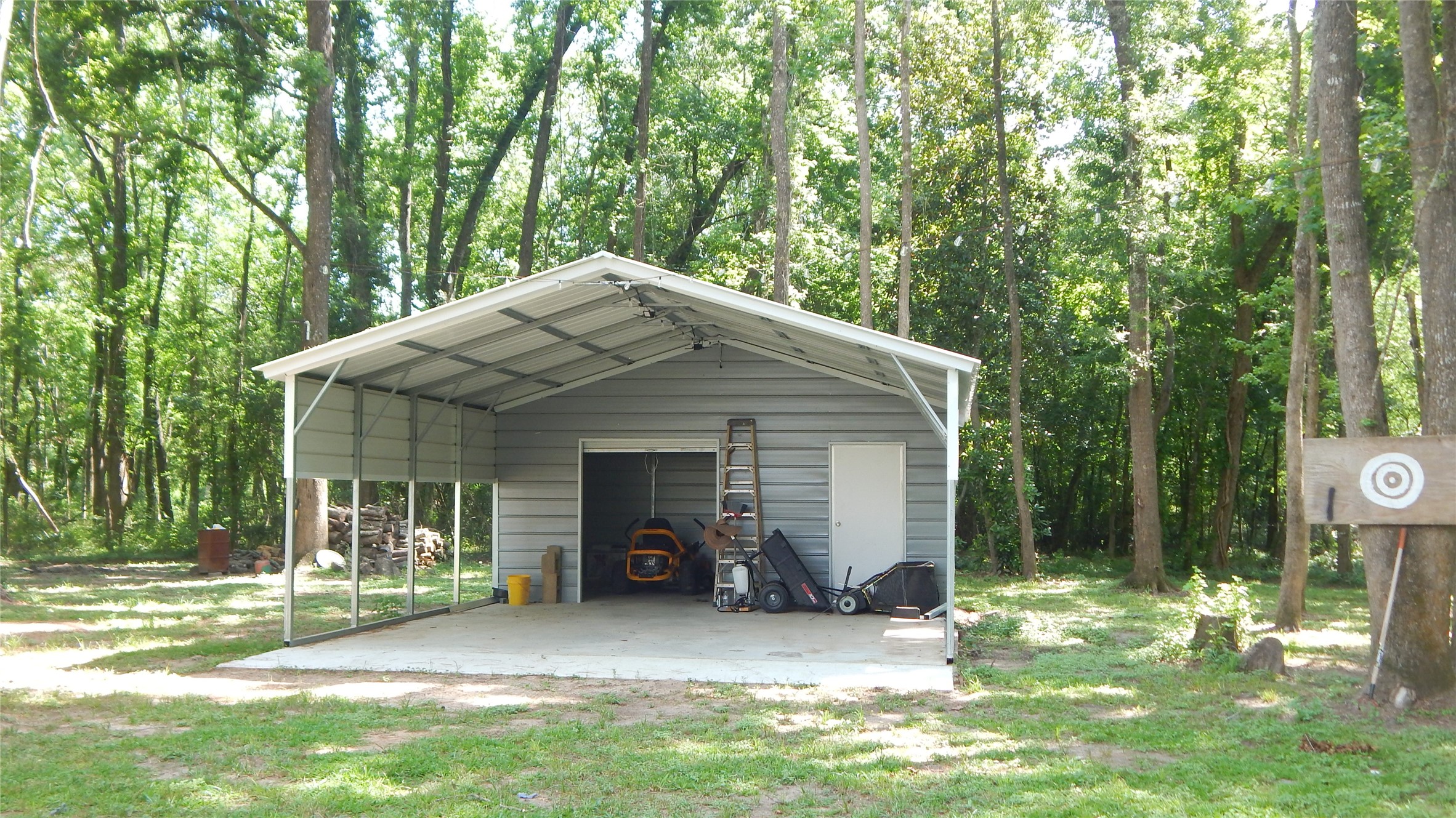 142 County Road 1332 Liberty, TX 77575 - Photo 19 of 50 a view of a house with backyard and trees