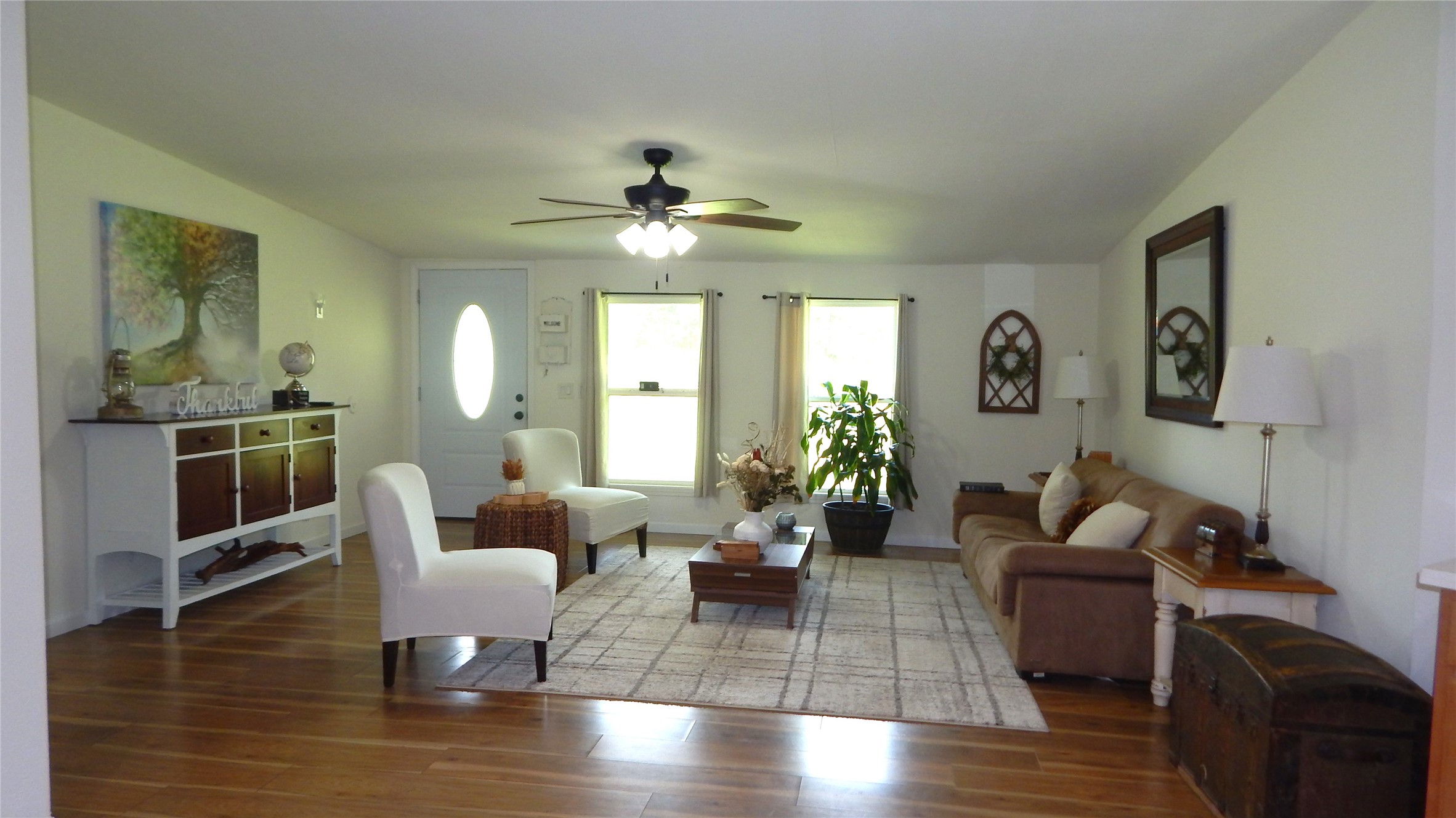 142 County Road 1332 Liberty, TX 77575 - Photo 2 of 50 a living room with furniture or wooden floor and a large window