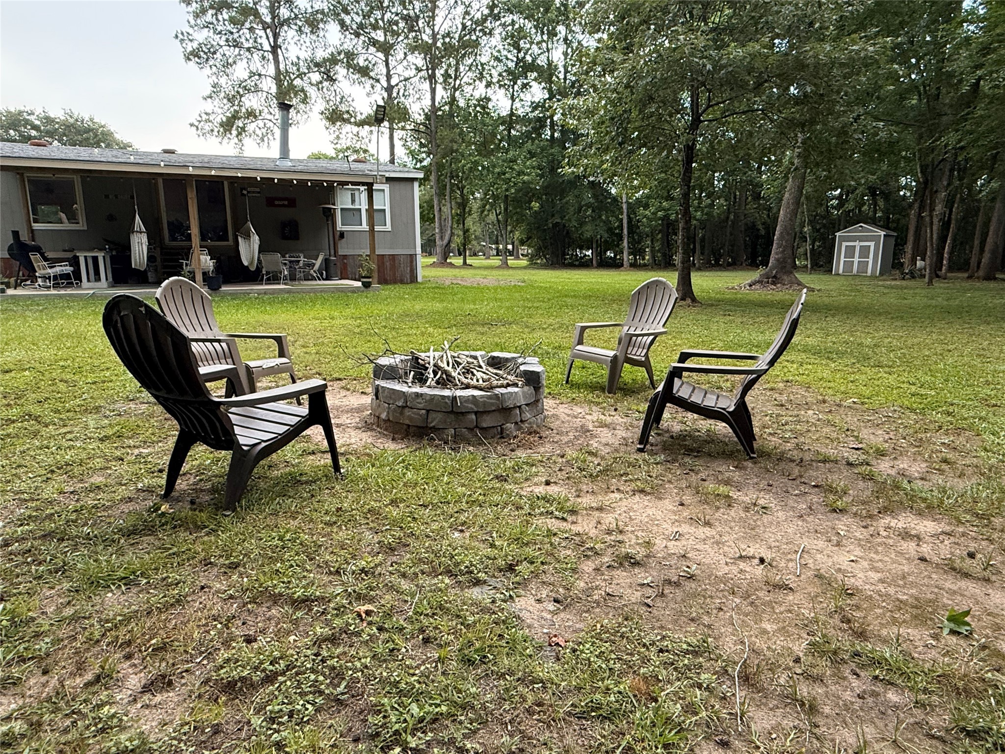 142 County Road 1332 Liberty, TX 77575 - Photo 23 of 50 a view of a house with backyard sitting area and garden