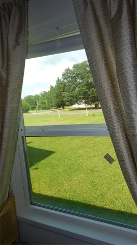 a patio with table and chairs