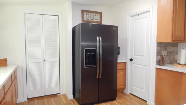 a stove top oven sitting inside of a kitchen