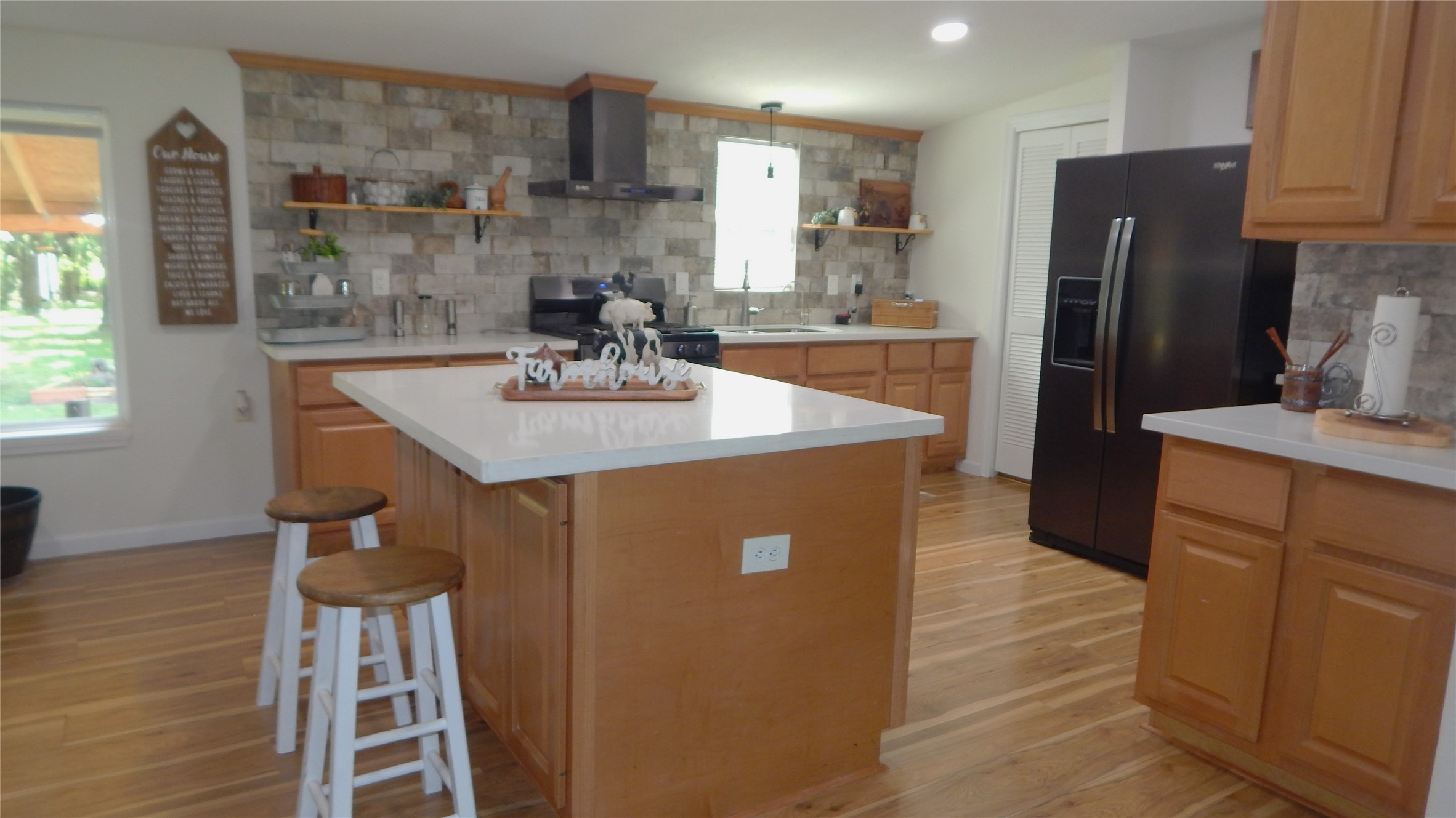 142 County Road 1332 Liberty, TX 77575 - Photo 4 of 50 a kitchen with stainless steel appliances granite countertop a sink a refrigerator and a stove