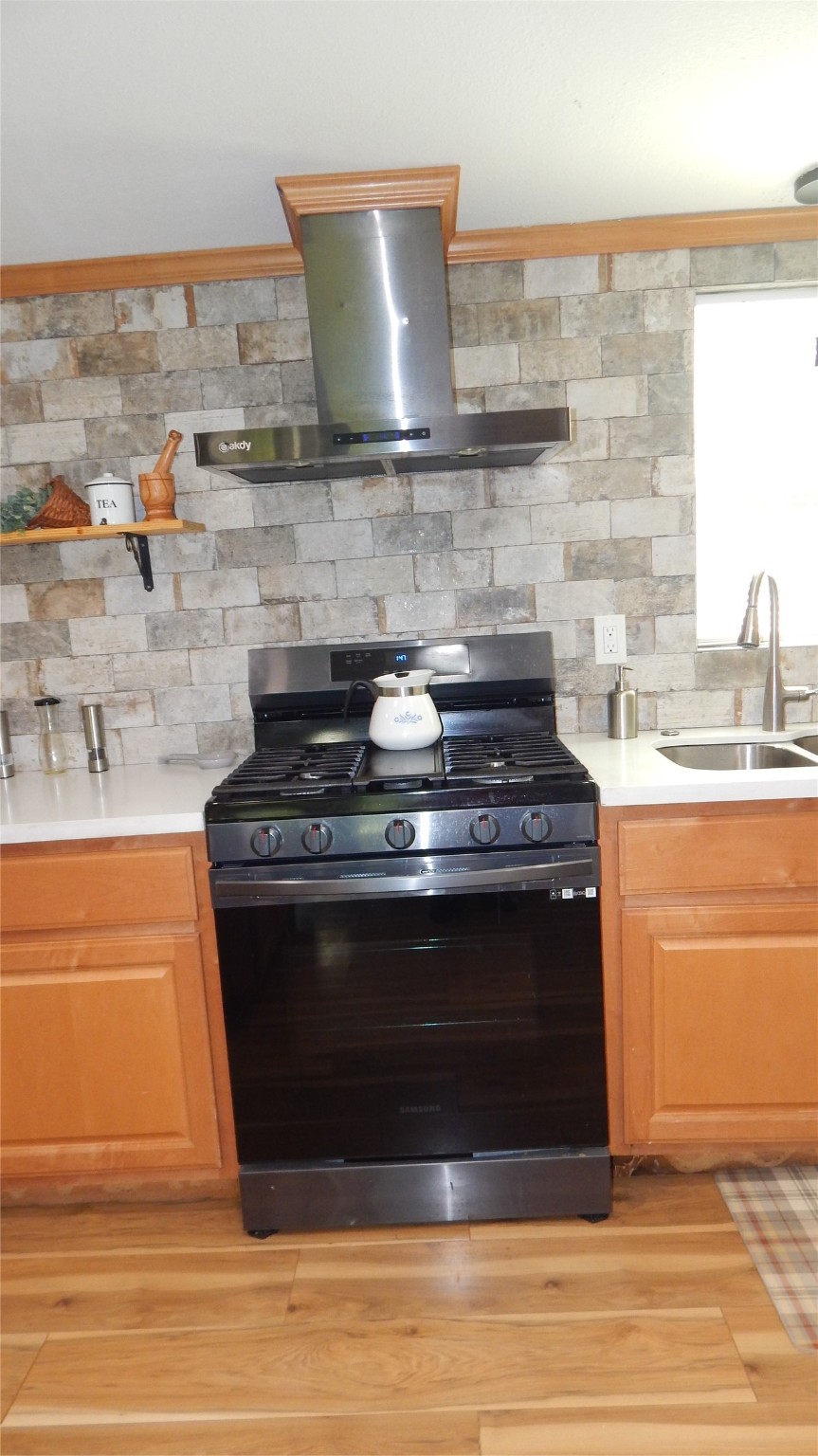 142 County Road 1332 Liberty, TX 77575 - Photo 41 of 50 a stove top oven sitting inside of a kitchen