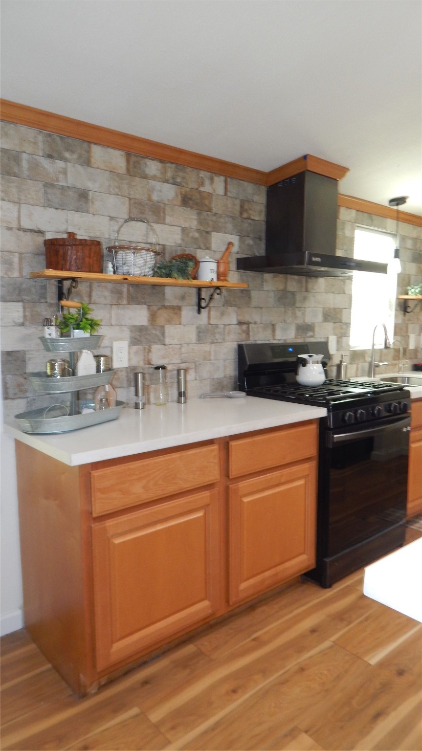 142 County Road 1332 Liberty, TX 77575 - Photo 5 of 50 a kitchen with stainless steel appliances granite countertop a stove a sink and a microwave
