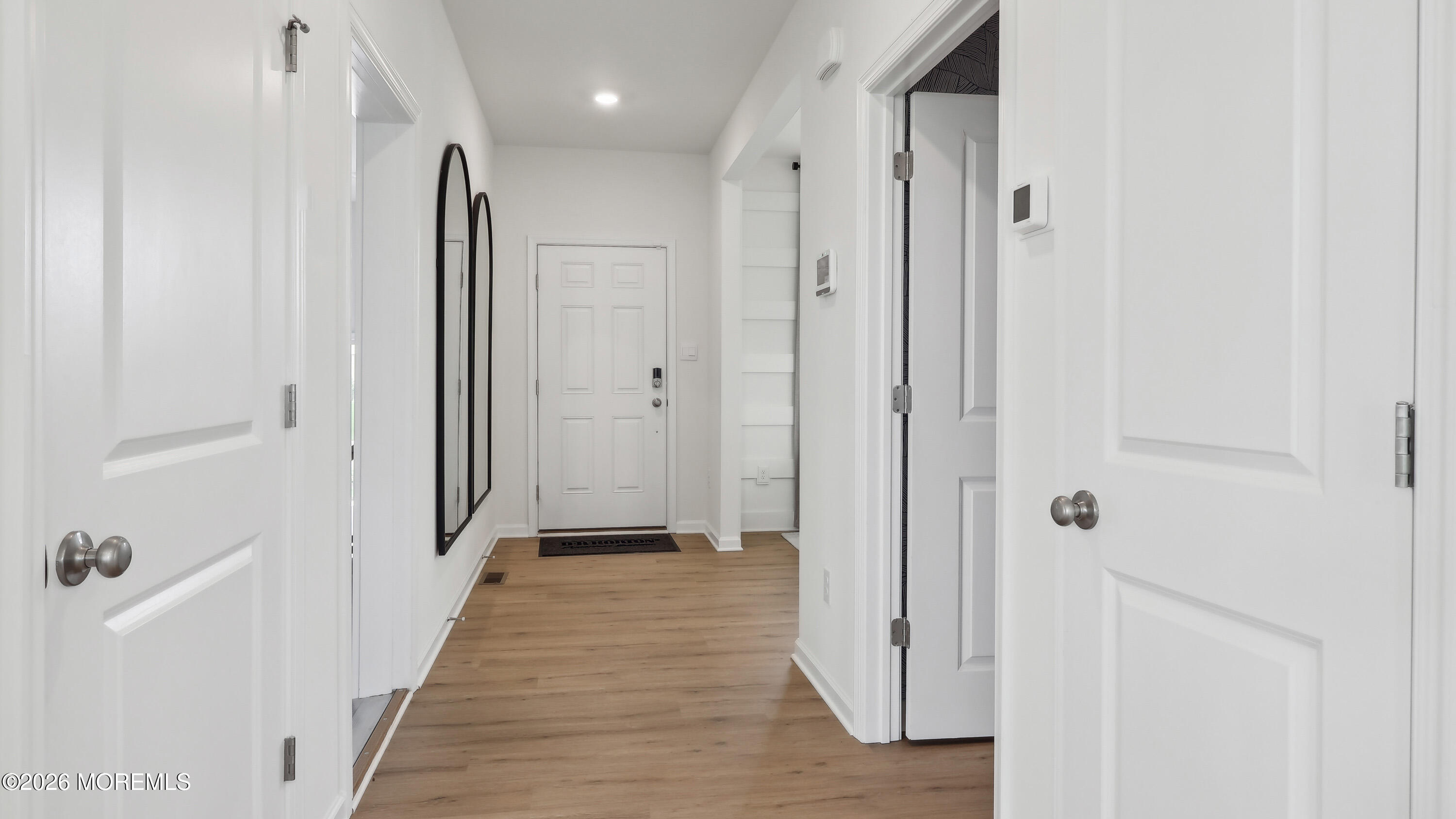 445 Ridge Avenue Hamilton, NJ 08610 - Photo 3 of 33 a view of a hallway with wooden floor and closet area
