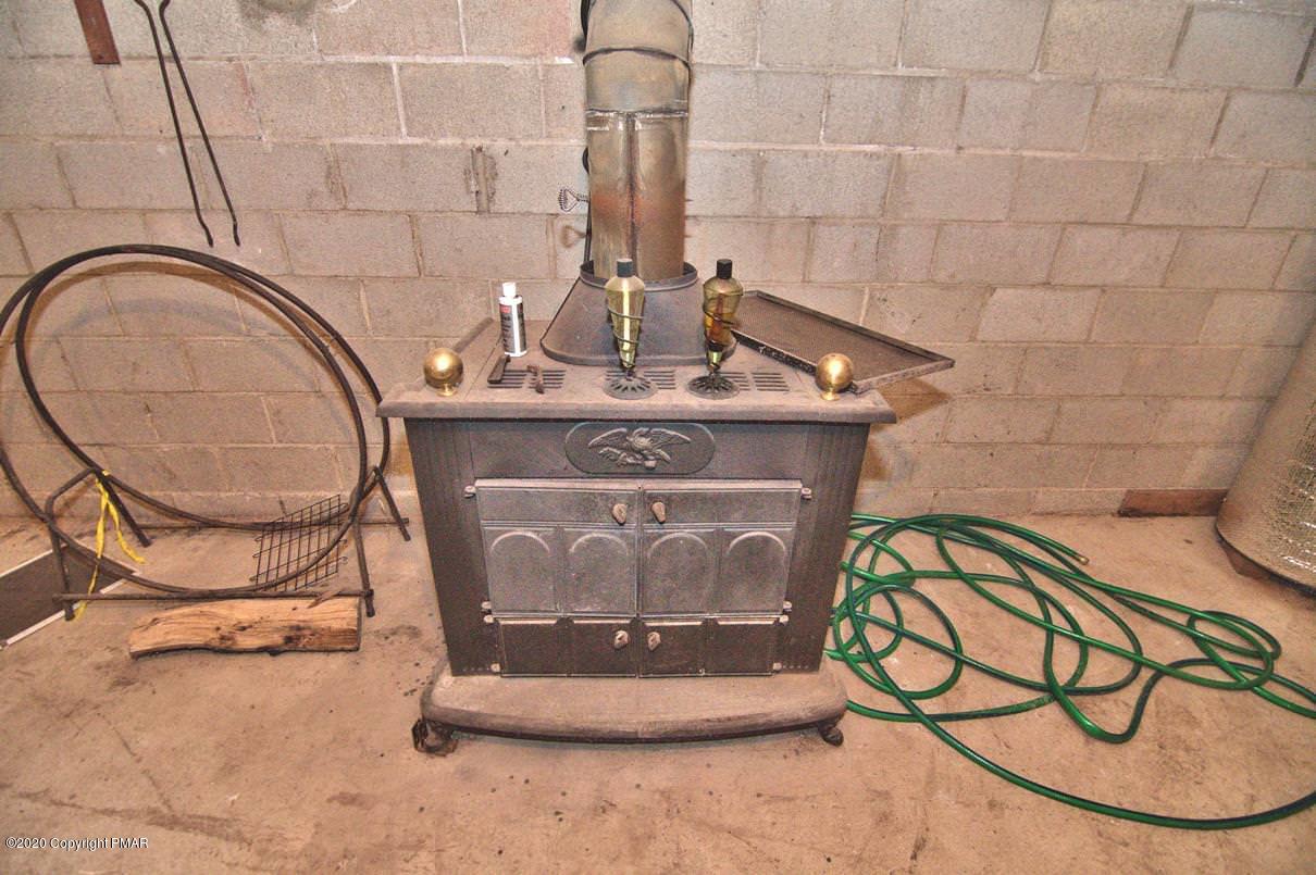 425 Ridge Circle Cresco, PA 18326 - Photo 47 of 58 Woodstove in basement