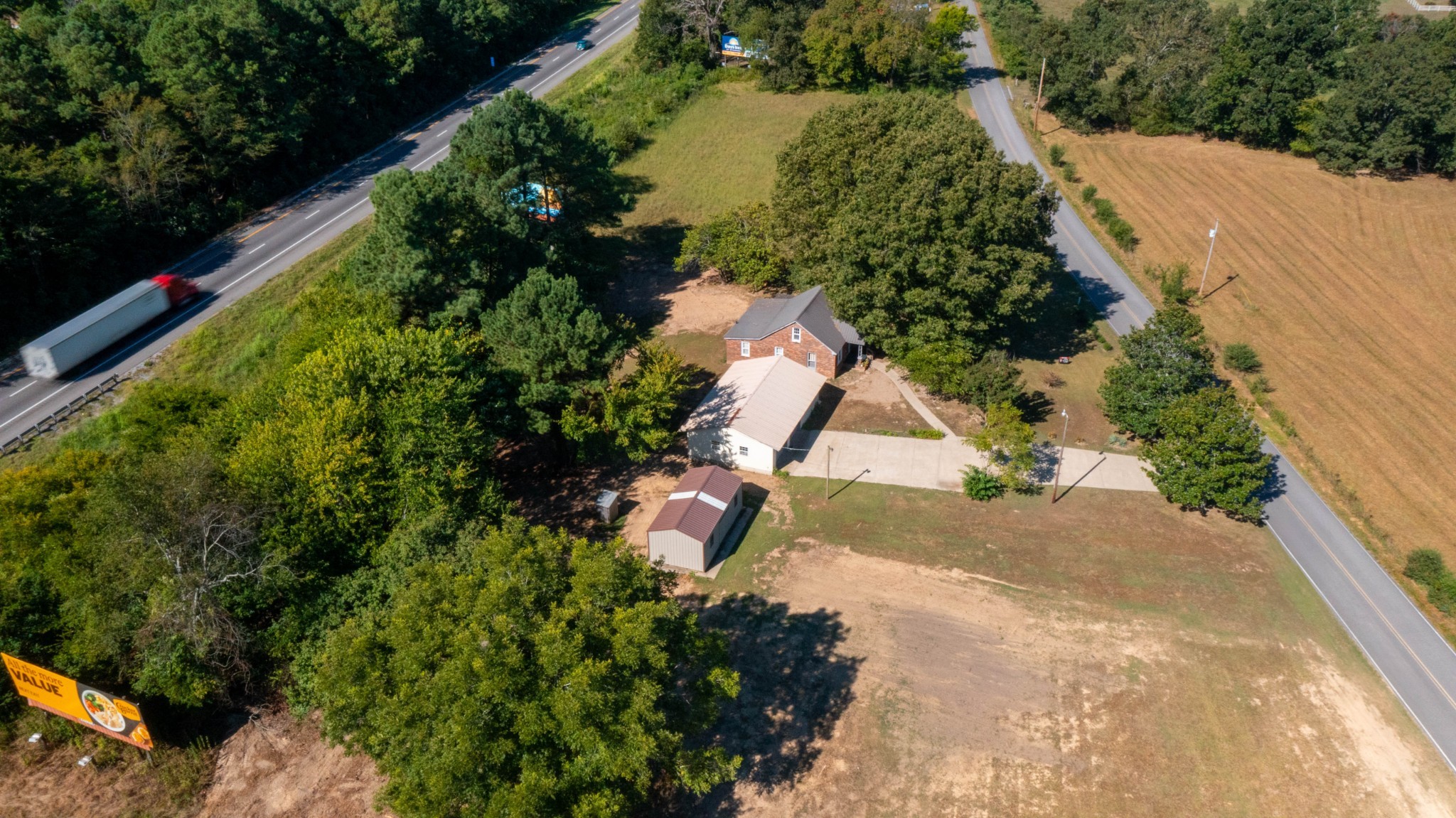 1210 Garton Road Burns, TN 37029 - Photo 14 of 34 an aerial view of a house with a yard and garden