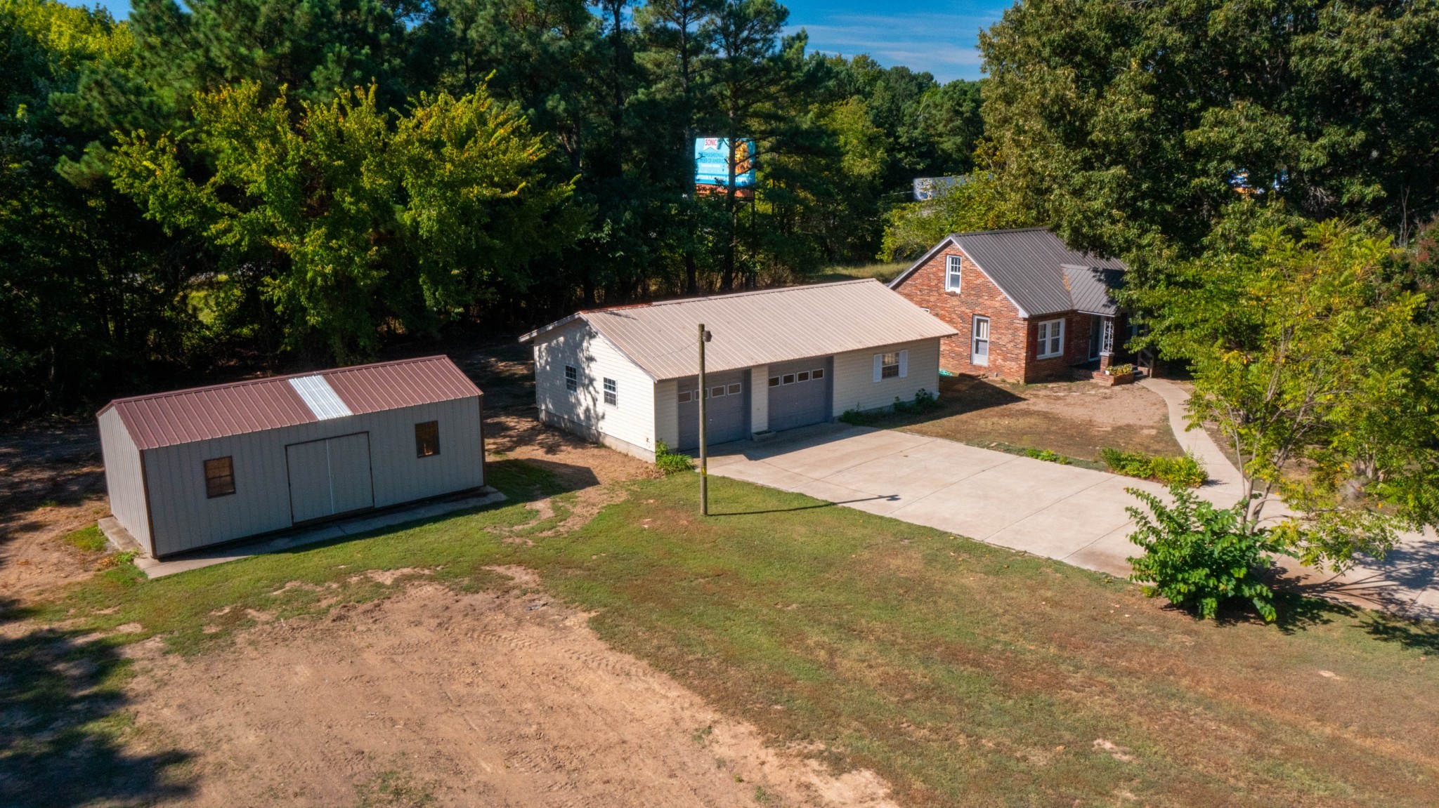1210 Garton Road Burns, TN 37029 - Photo 15 of 34 a aerial view of a house with swimming pool and large trees