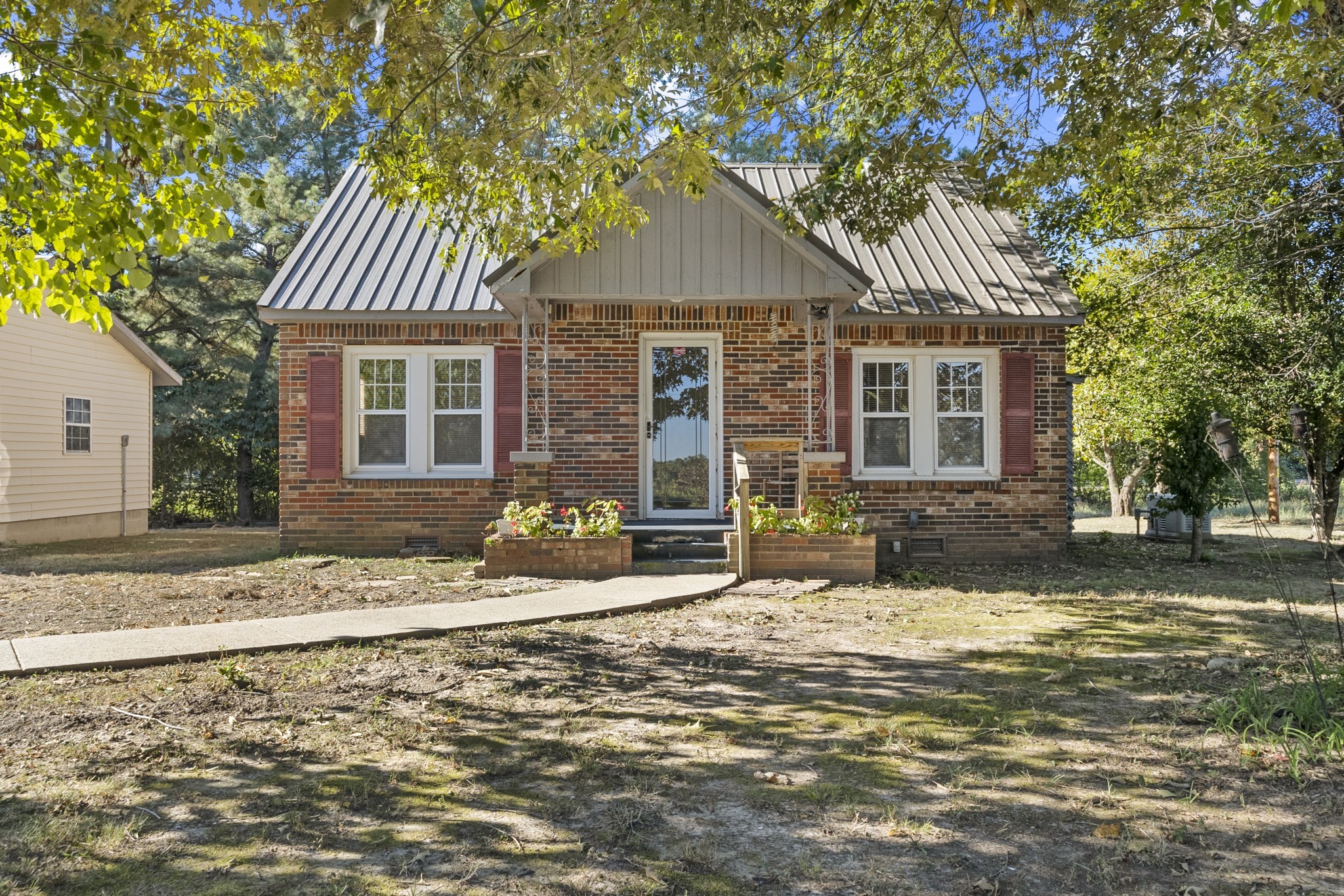 1210 Garton Road Burns, TN 37029 - Photo 17 of 34 a front view of a house with a yard