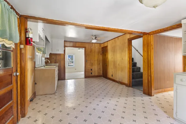 an empty room with windows and closet