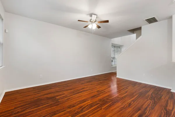 a view of kitchen with granite countertop cabinets and wooden floor