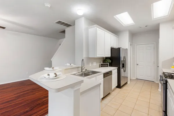 a view of cabinets and window