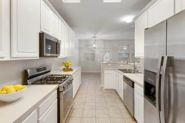 a kitchen with a sink and stove