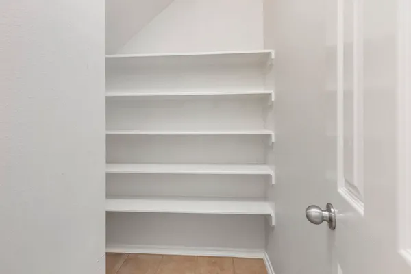 a kitchen with a stove and a refrigerator