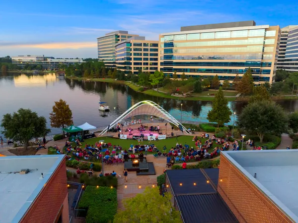an aerial view of a house roof deck and outdoor seating