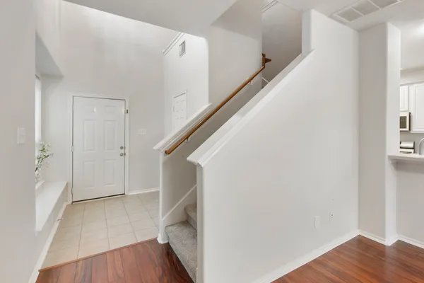 a view of entryway with wooden floor