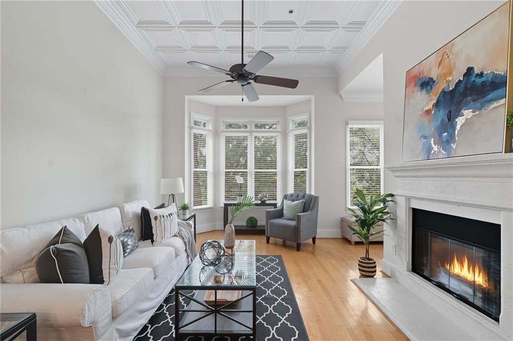 825 Highland Lane Northeast, Unit 1312 Atlanta, GA 30306 - Photo 21 of 46 a living room with furniture and a fireplace