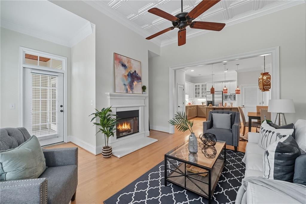 825 Highland Lane Northeast, Unit 1312 Atlanta, GA 30306 - Photo 23 of 46 a living room with furniture and a fireplace