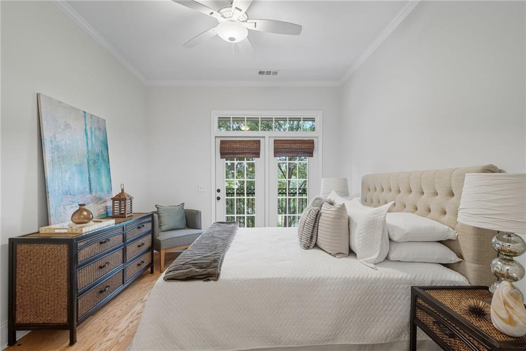 825 Highland Lane Northeast, Unit 1312 Atlanta, GA 30306 - Photo 27 of 46 a bedroom with a bed and window