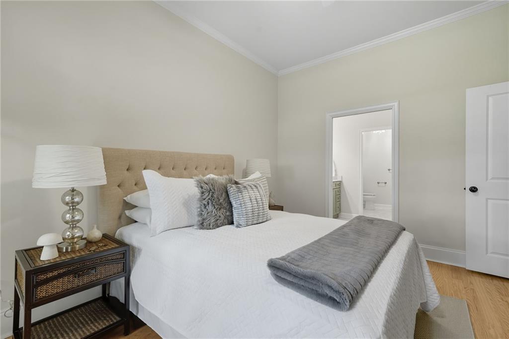 825 Highland Lane Northeast, Unit 1312 Atlanta, GA 30306 - Photo 28 of 46 a bedroom with a bed and lamp