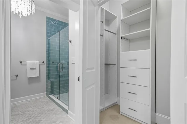 a en suite bathroom with a double vanity sink and a mirror