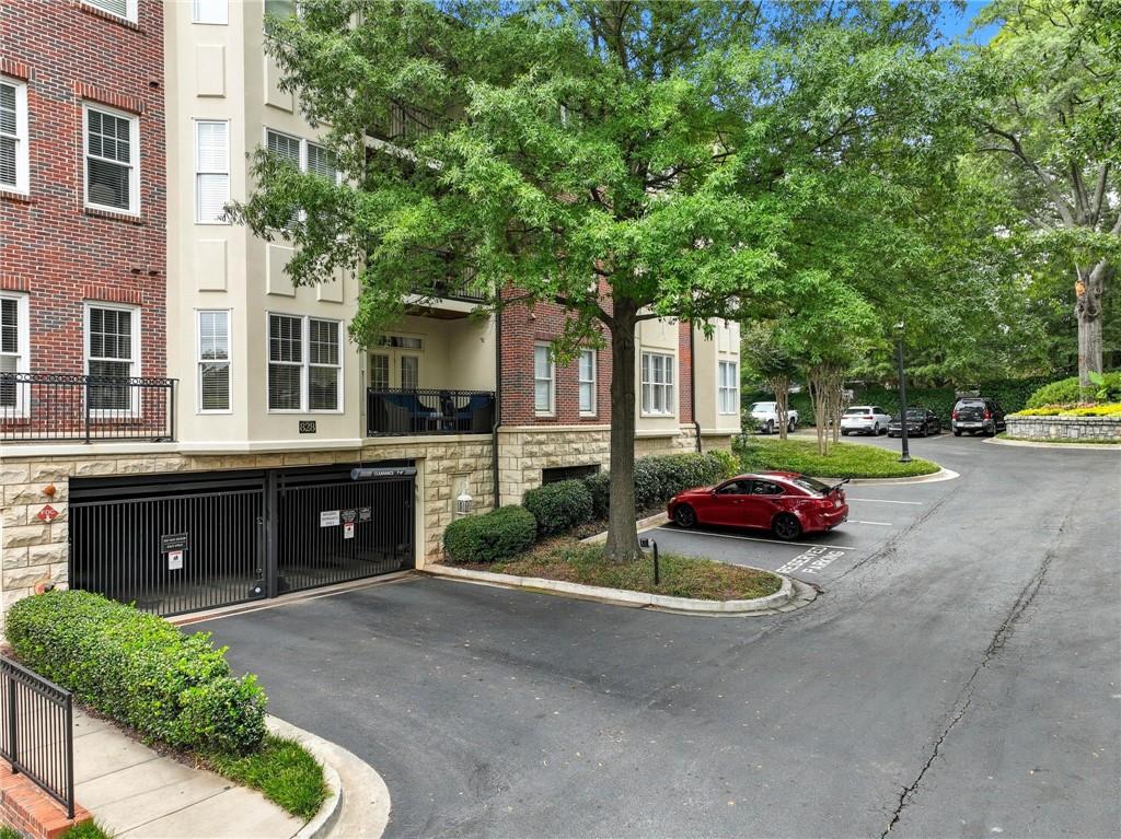 825 Highland Lane Northeast, Unit 1312 Atlanta, GA 30306 - Photo 4 of 46 a car parked in front of a brick house