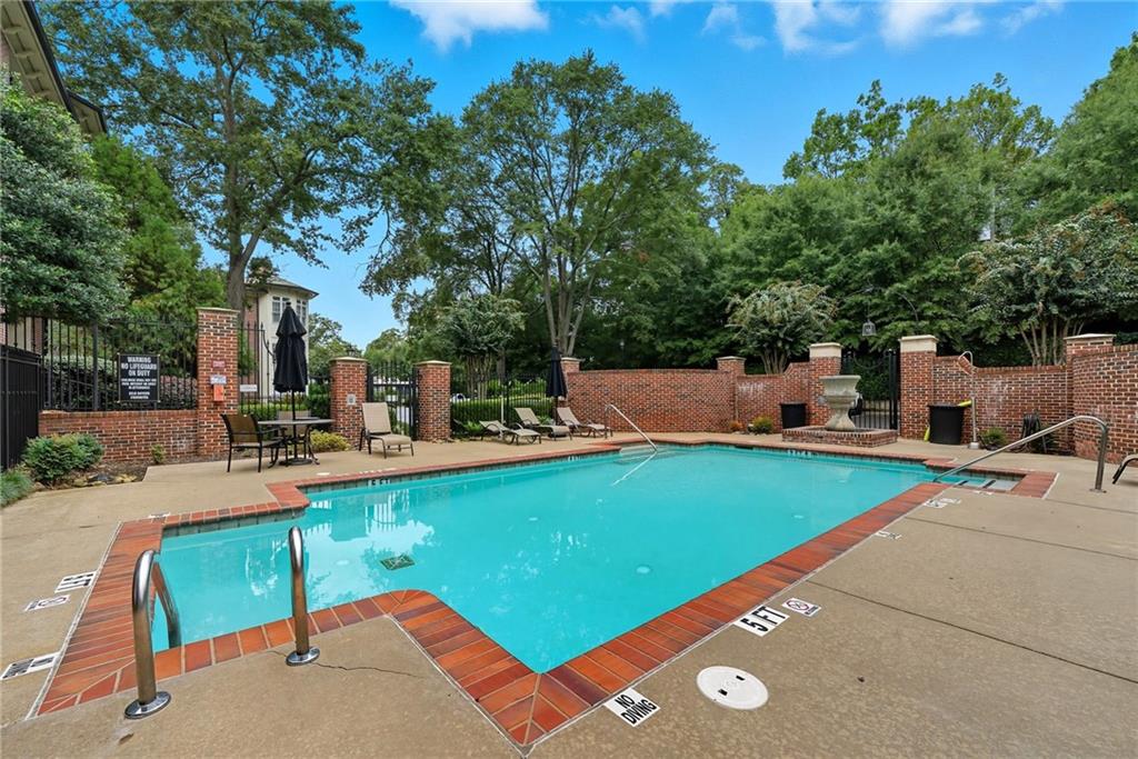 825 Highland Lane Northeast, Unit 1312 Atlanta, GA 30306 - Photo 41 of 46 an outdoor space with swimming pool and furniture