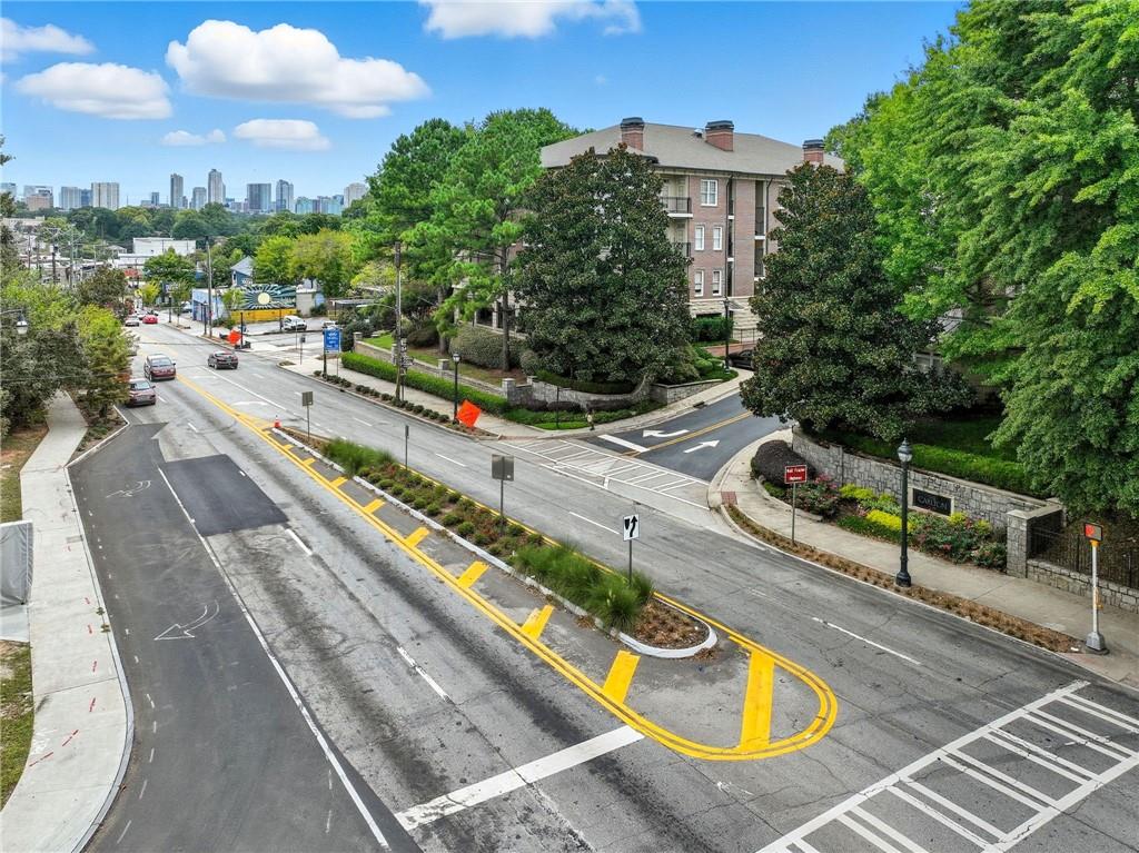 825 Highland Lane Northeast, Unit 1312 Atlanta, GA 30306 - Photo 5 of 46 a view of a swimming pool with a patio and a yard