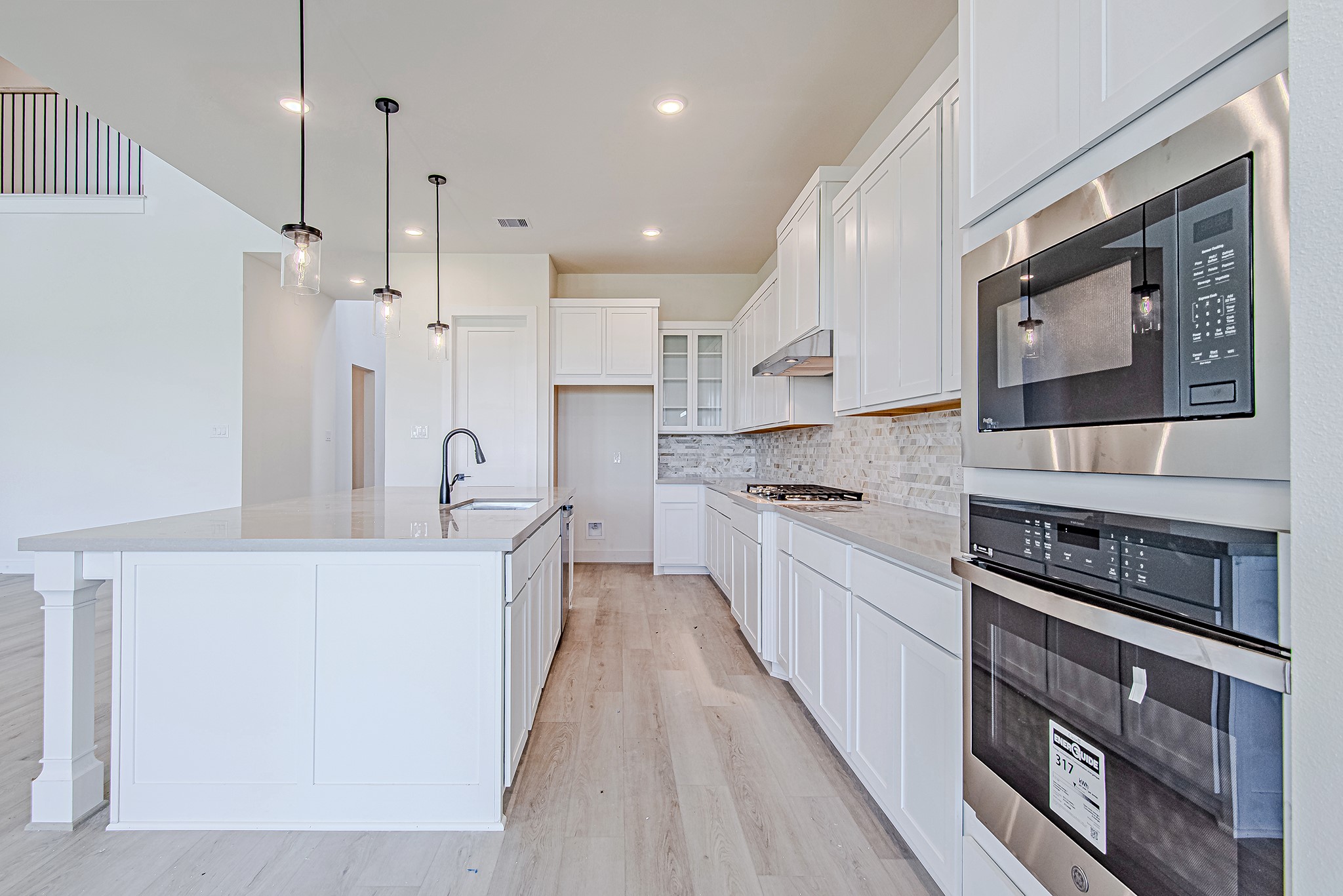153 Peninsula Point Drive Montgomery, TX 77356 - Photo 12 of 46 Sleek double ovens and clean-lined cabinetry bring both function and style