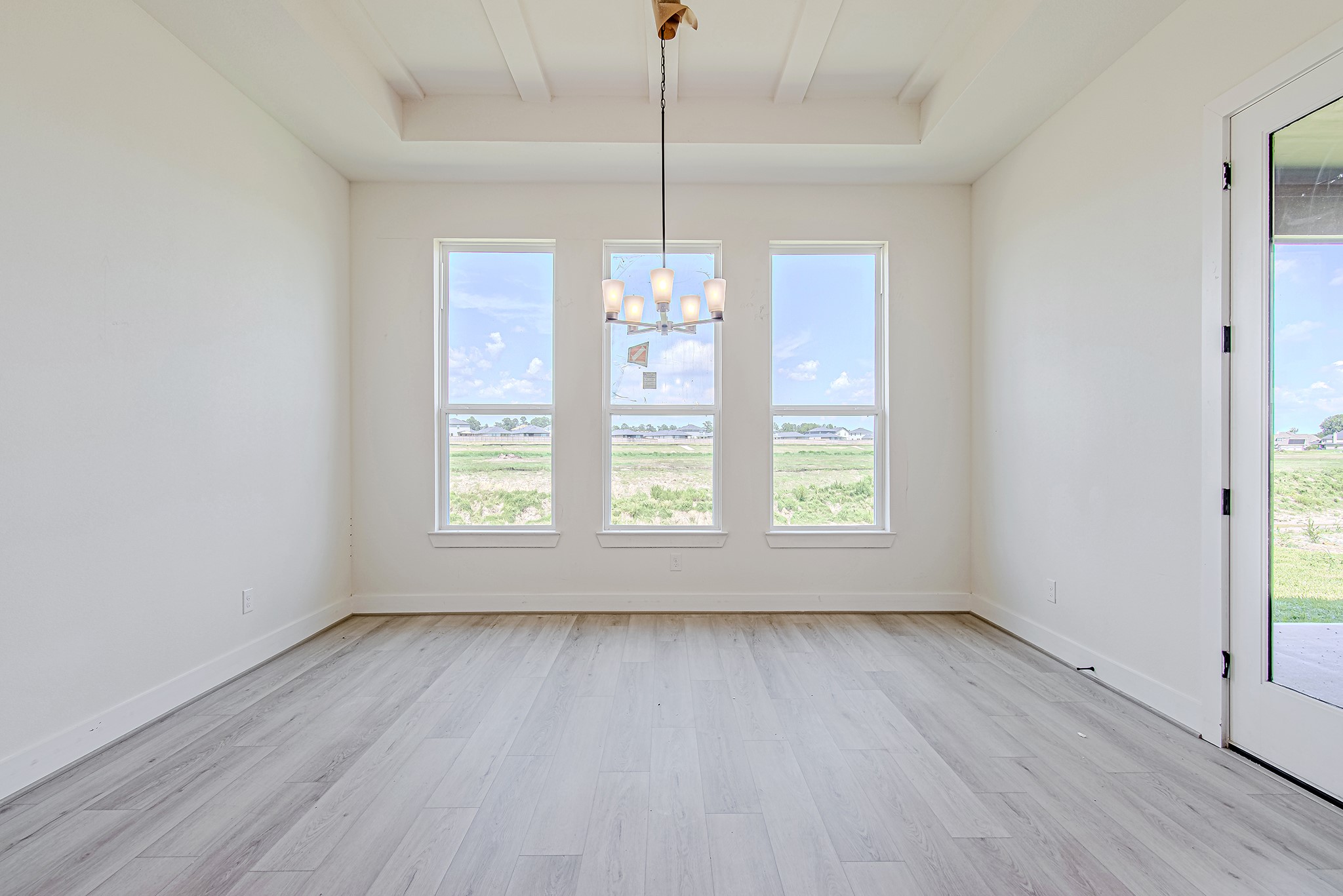 153 Peninsula Point Drive Montgomery, TX 77356 - Photo 14 of 46 Sunlit dining area with walls of windows overlooking the backyard