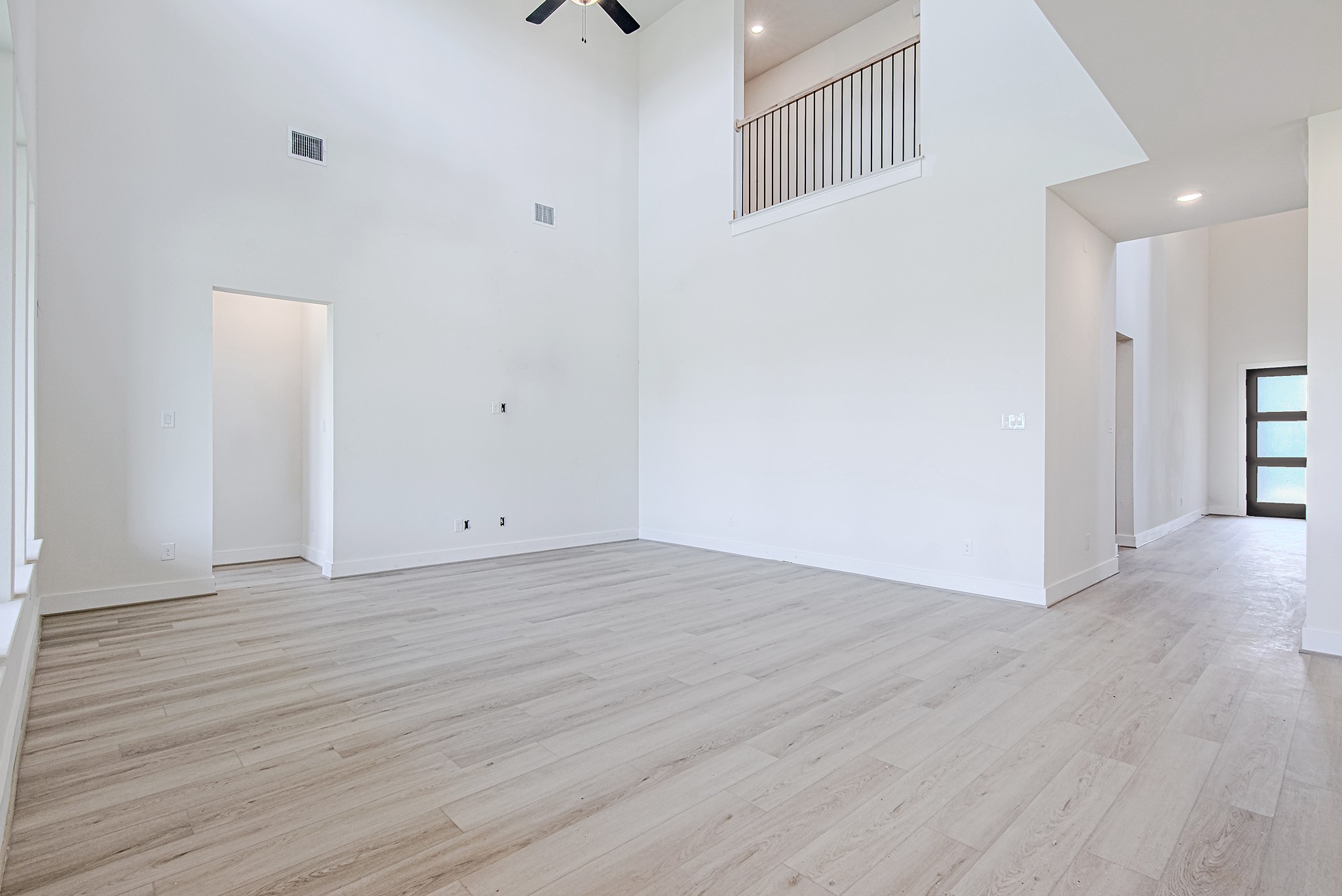 153 Peninsula Point Drive Montgomery, TX 77356 - Photo 16 of 46 Impressive double-height ceiling in the living area creates an airy, grand feel