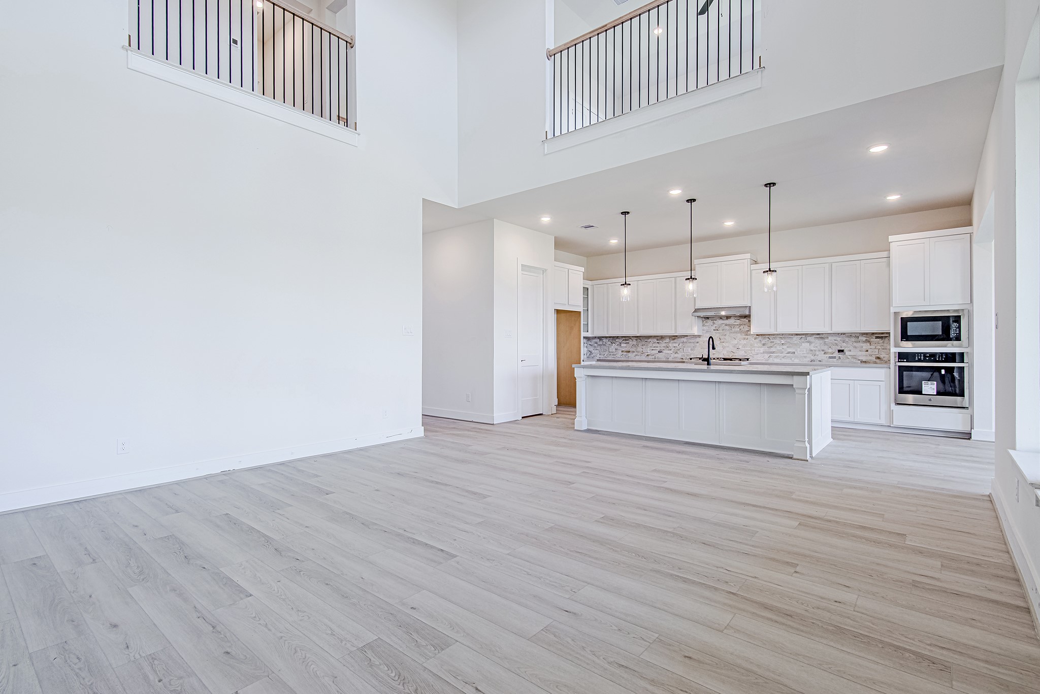 153 Peninsula Point Drive Montgomery, TX 77356 - Photo 3 of 46 Step inside to a soaring two-story entry that sets a dramatic first impression